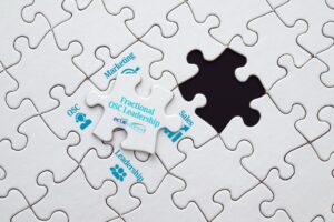 A white jigsaw puzzle with one loose piece reading Fractional OSC Leadership and the Blue Gypsy logo, ready to fill the missing gap